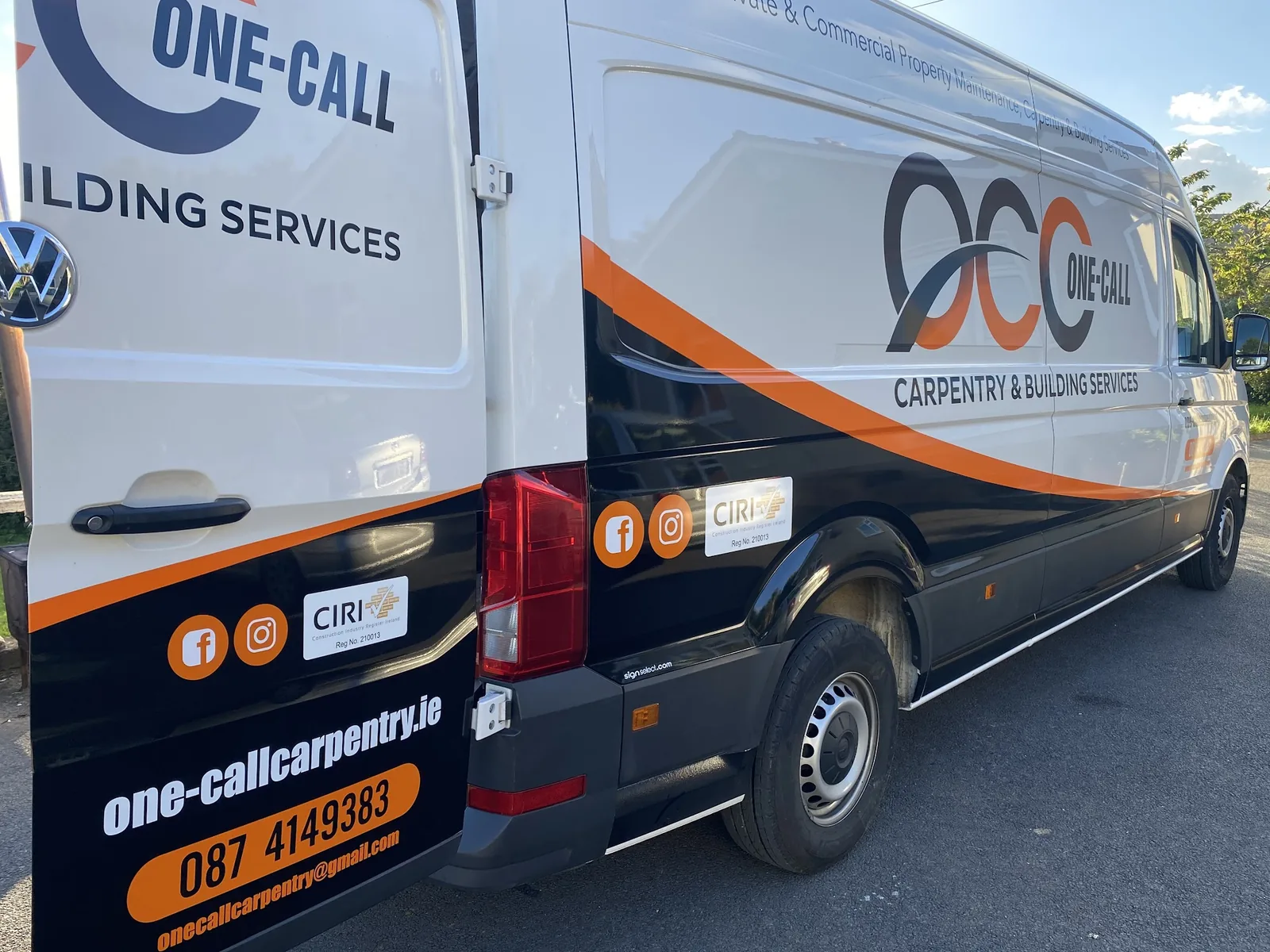 Rear of the One-Call Carpentry van showing contact details, registration plate and CIRI, Facebook and Instagram credentials