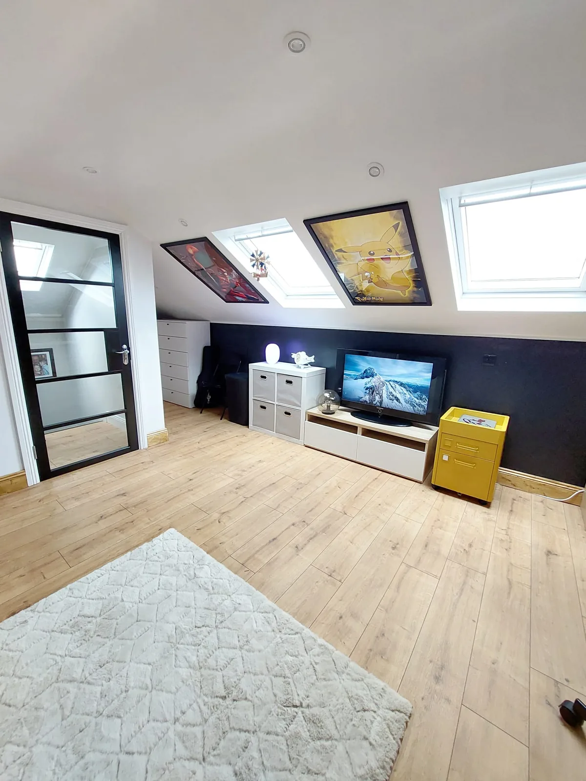 Attic conversion with twin skylights and oak laminate floor